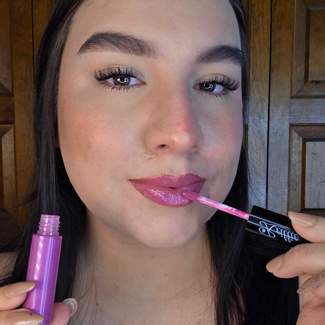 Reillie Beauty Dragon Fruit Lip Gloss applied on lips of fair skin for glossy fuchsia shimmer