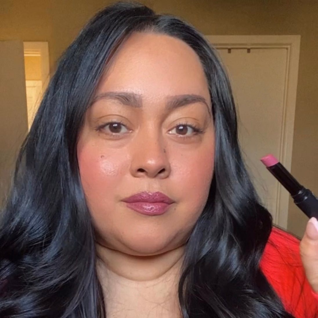 "Reillie Beauty Calla Lily Lipstick applied on dark skin, rich mauve finish