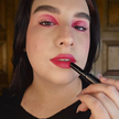 Reillie Beauty Daylily Lipstick applied on lips for bright red finish on fair skin