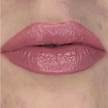 Woman with fair skin wearing Berry Glow Lip Gloss, clear shimmering shade with nourishing botanicals