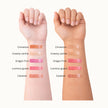 Two arms with different colored lip glosses swatches 