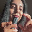 Woman applying tint on her cheeks