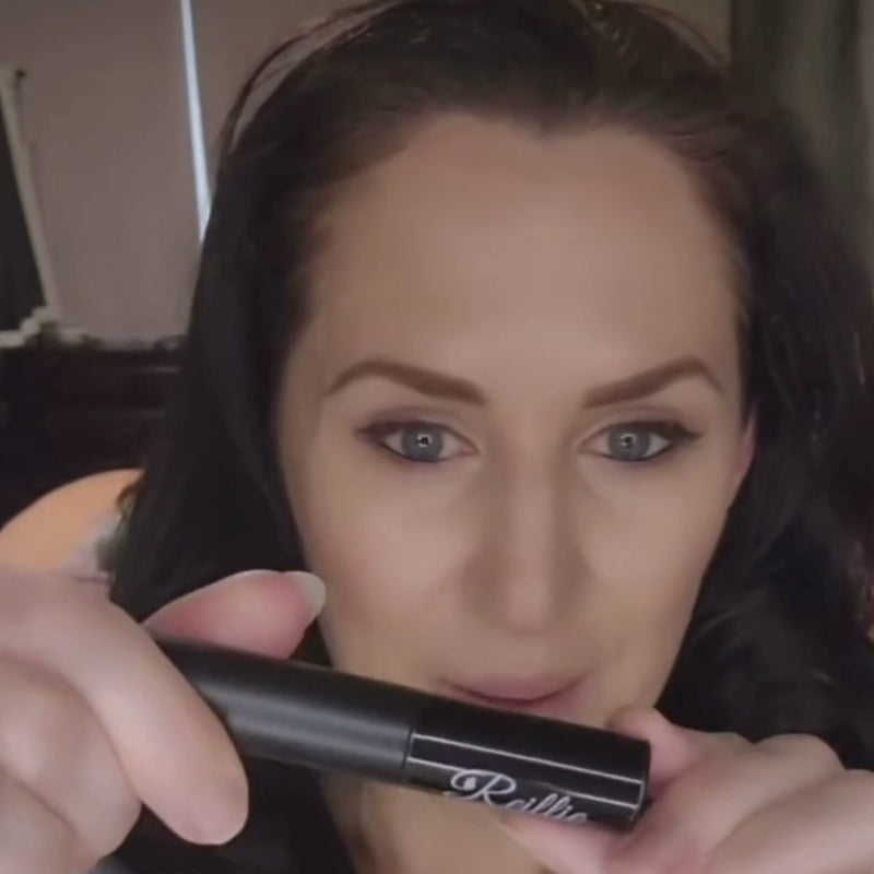 Woman applying Reillie Beauty Organic  mascara