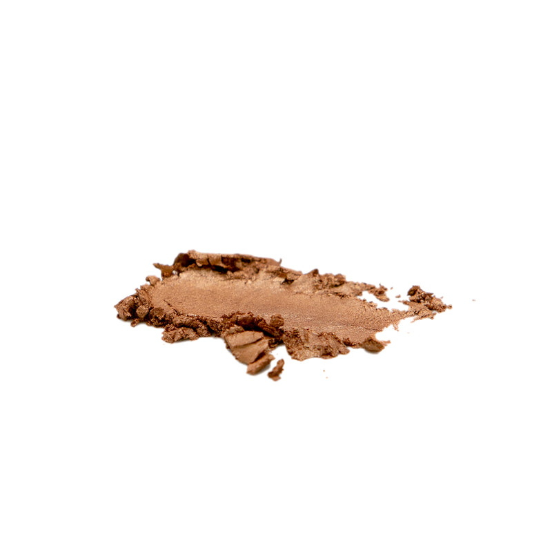 Reillie Beauty Topaz Bronzer swatch showing natural golden glow