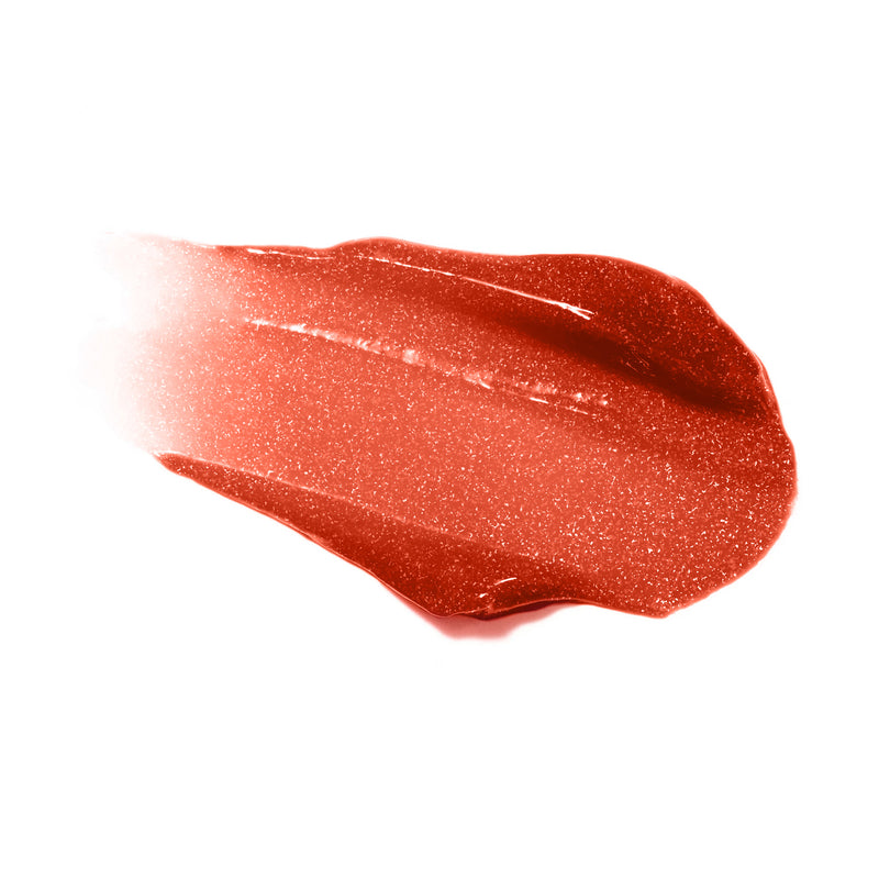 Swatch of Reillie Beauty Organic Lip Gloss in Cinnamon, warm orange shimmering shade with nourishing botanicals